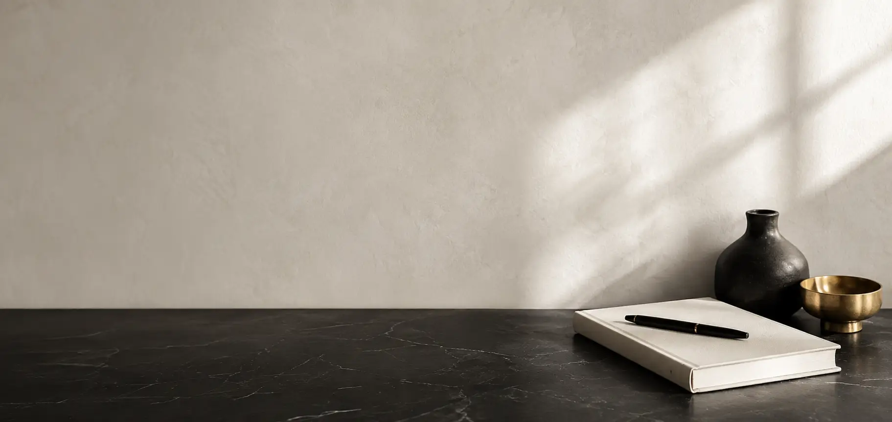 Quiet income system represented by a premium black cream and gold workspace